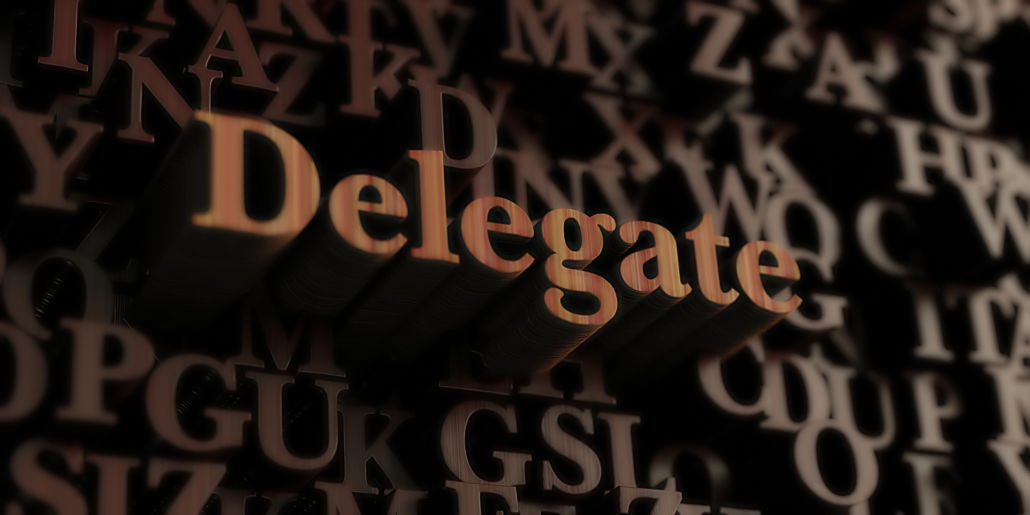 wooden letters with Delegate standing out