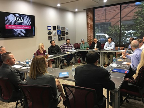 team in a square setup having a meeting