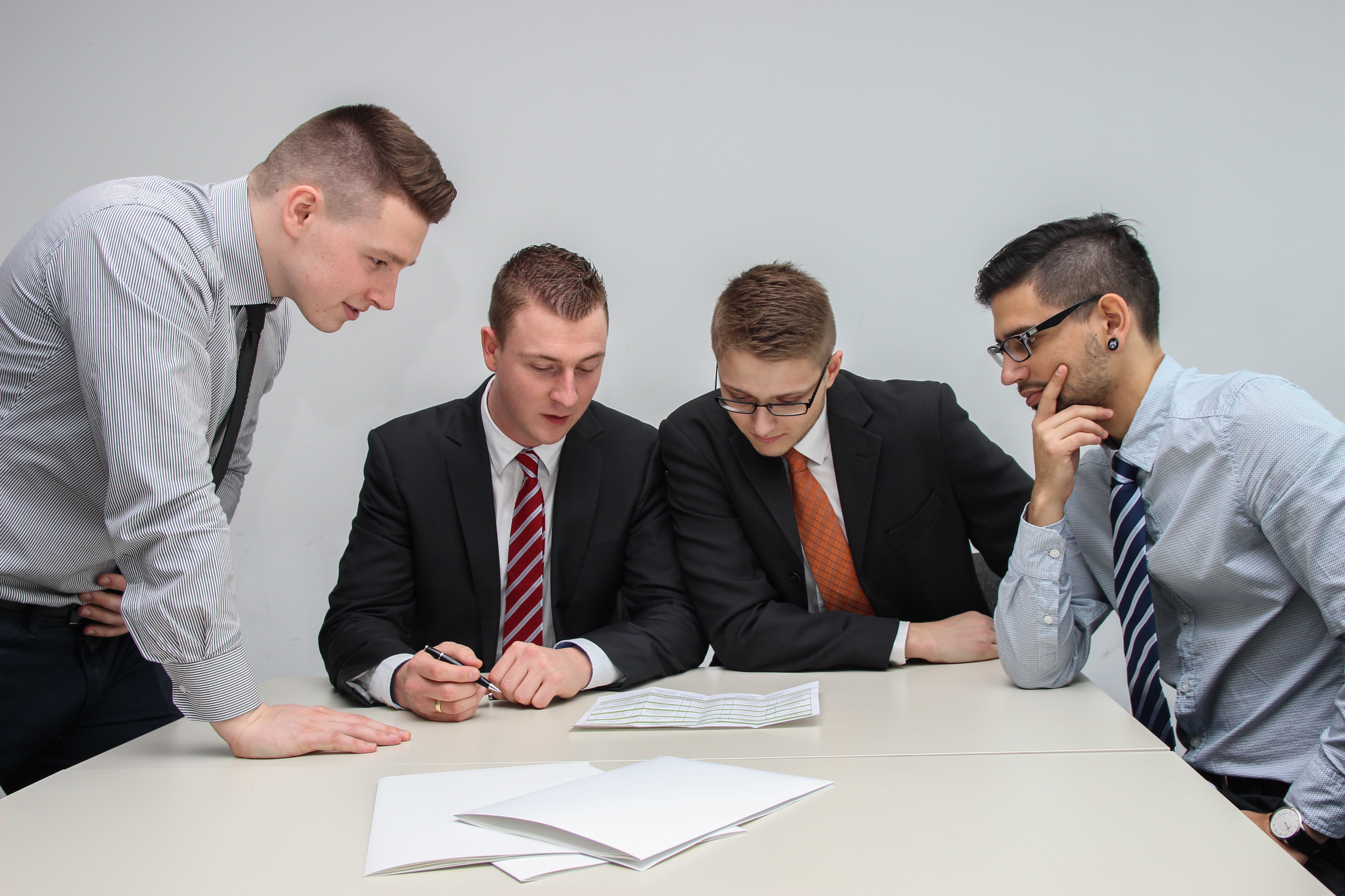 businessmen reviewing files